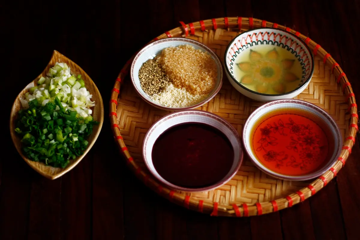 Rolling nem spring rolls for Bun Cha