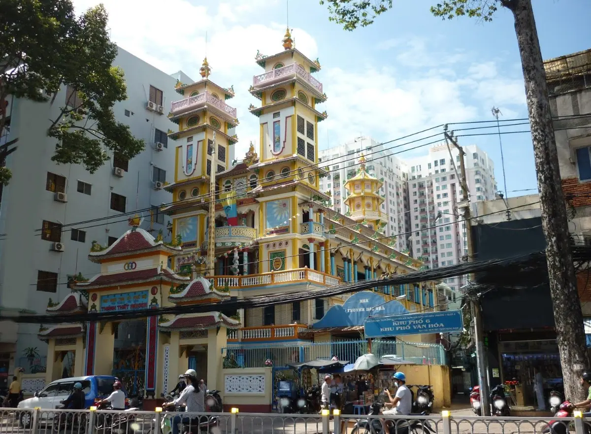 Cao Dai Temple in Saigon — ornate pillars, Divine Eye, and vibrant syncretic architecture