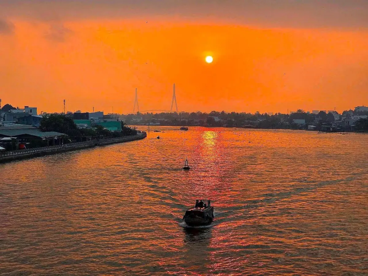 Misty morning on the Mekong River, traditional boats, tranquil Indochina landscape
