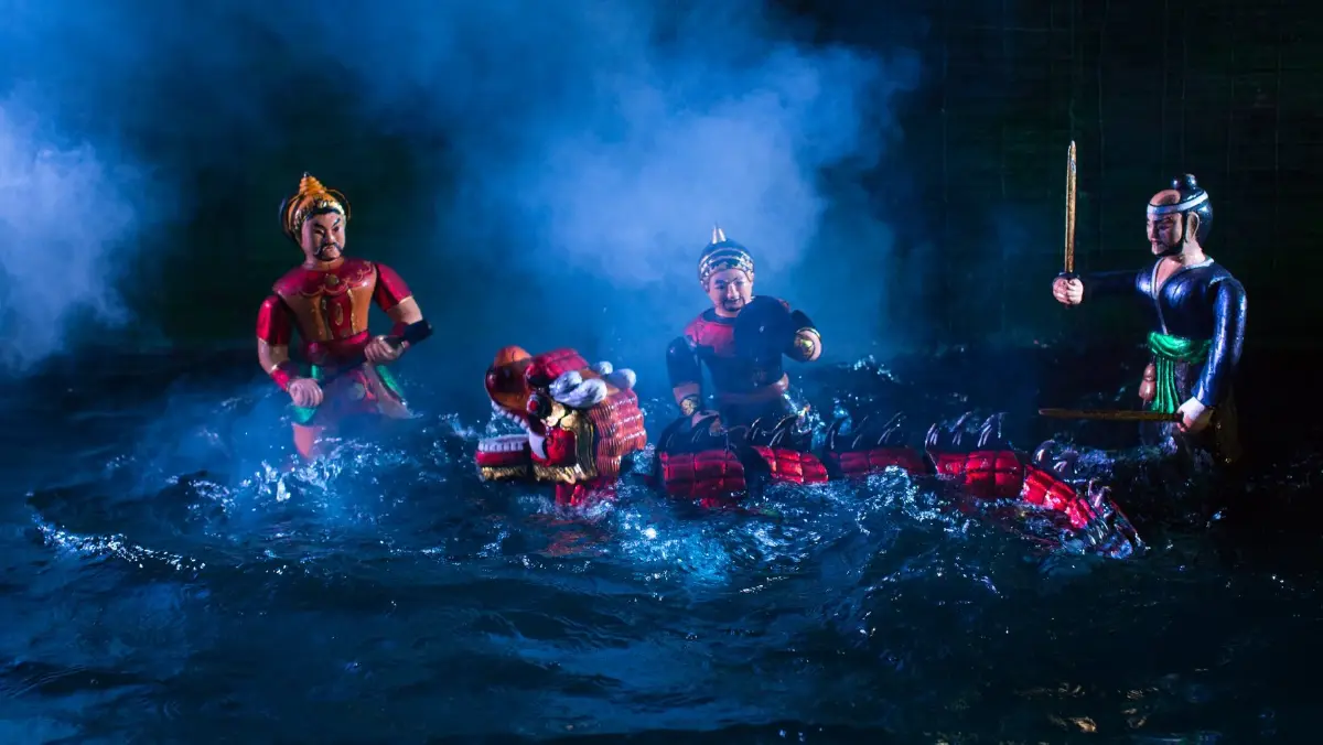 Water puppetry performance in Vietnam with wooden puppets on water stage