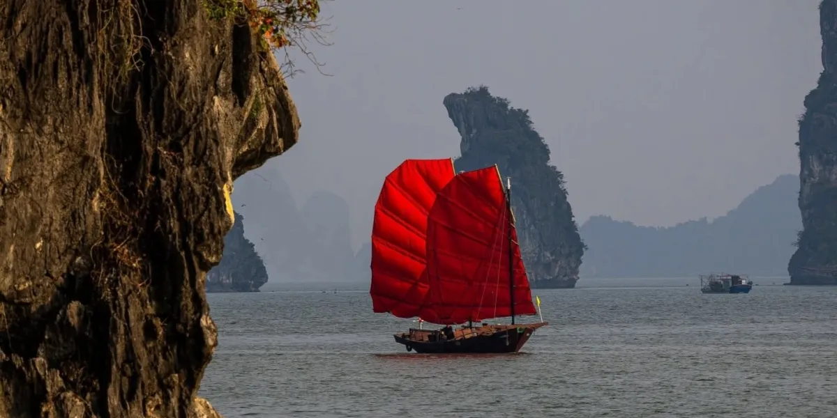 Traditional red sail boat in Halong Bay Vietnam luxury travel