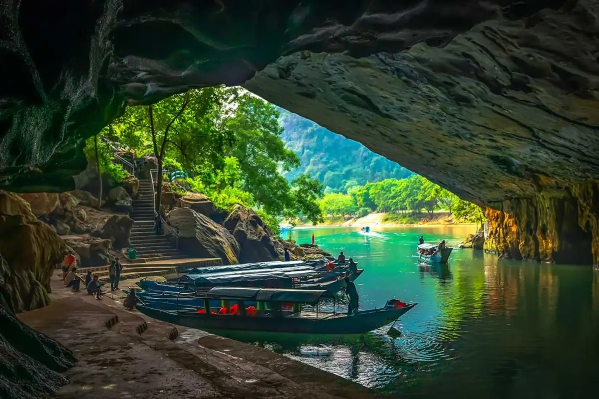 Tour boat inside Phong Nha Cave with limestone formations